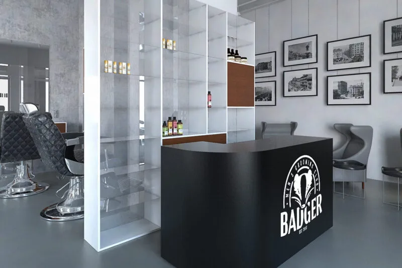 Nowoczesne wnętrze salonu barberskiego z ladą recepcyjną i przeszklonym regałem – projektowanie wnętrz komercyjnych Warszawa