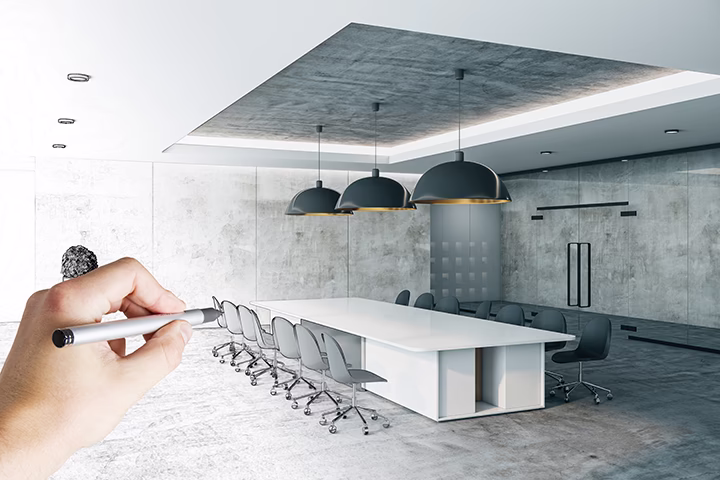 Ręka projektująca nowoczesną salę konferencyjną w stylu industrialnym.