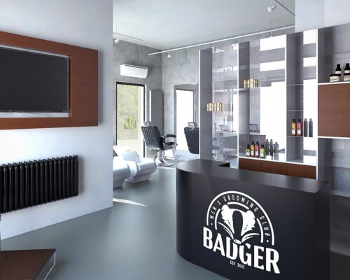 Stylowa recepcja w salonie Badger – minimalistyczny design i ekspozycja kosmetyków Recepcja nowoczesnego salonu barberskiego z półkami i logotypem Badger