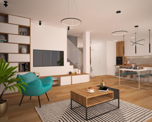 Przestrzeń do życia – otwarta strefa dzienna łącząca funkcje salonu, jadalni i kuchni. Szerokie ujęcie na otwartą strefę dzienną z salonem z turkusowym fotelem i jadalnią w tle.