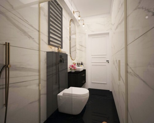 Elegancja w małym formacie – grafitowa ściana jako tło dla białej ceramiki w nowoczesnej toalecie. Nowoczesna toaleta z podwieszaną miską WC i ścianą wykończoną płytkami imitującymi czarny kamień.