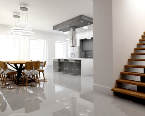 Serce domu – otwarta przestrzeń dzienna łącząca nowoczesną kuchnię z wyspą i rodzinną jadalnią. Otwarta, biała kuchnia z dużą wyspą i okapem, połączona z przestronną jadalnią.