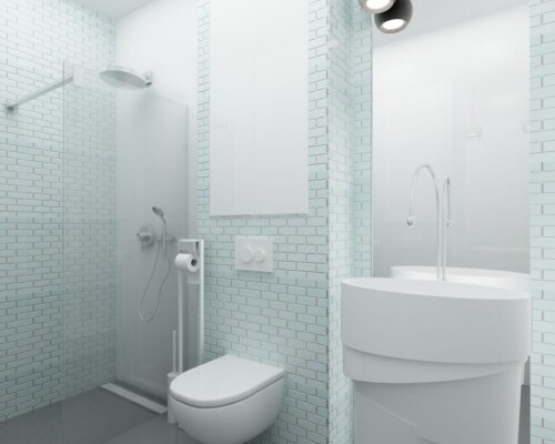 Detal ma znaczenie – zbliżenie na strefę toaletową w nowoczesnej łazience. Ujęcie minimalistycznej łazienki z podwieszaną miską WC i designerską umywalką.