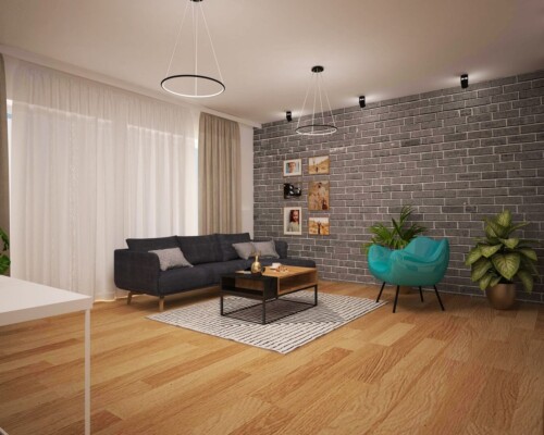 Kolor, faktura i styl – eklektyczny salon, w którym nowoczesność spotyka się z loftowym klimatem. Nowoczesny salon z szarą sofą, drewnianym stolikiem i turkusowym fotelem na tle ściany z cegły.