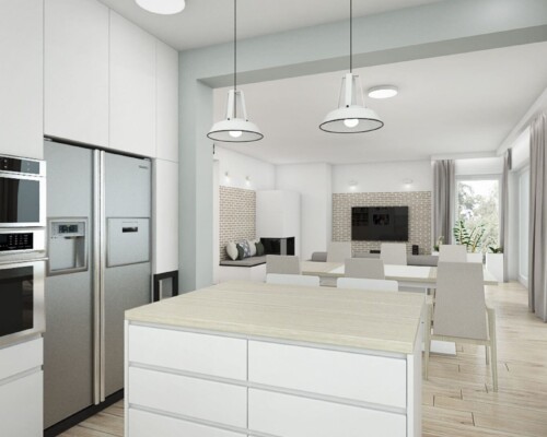 Nowoczesna strefa dzienna z kuchnią, jadalnią i salonem w jednej przestrzeni Widok z kuchni na jadalnię i salon w jasnym, otwartym wnętrzu