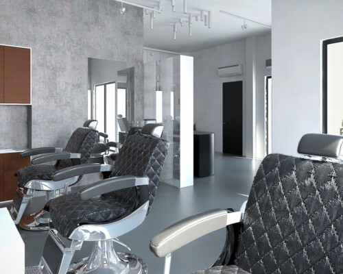 Ekskluzywne fotele barberskie w surowym wnętrzu salonu Badger Fotele barberskie na tle betonowej ściany – nowoczesny salon męski