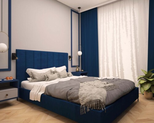 Stylowa sypialnia z eleganckim łóżkiem i designerskimi lampami wiszącymi Sypialnia z granatowym łóżkiem tapicerowanym i złotymi dodatkami