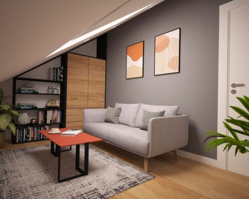 Twoje miejsce na relaks – przytulny kącik do czytania z energetycznym akcentem kolorystycznym. Przytulny kącik wypoczynkowy z szarą sofą, regałem na książki i obrazem w odcieniach pomarańczu.