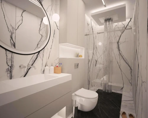 Stylowa łazienka – prostota i precyzja wykonania Łazienka z dużym lustrem, podwieszaną umywalką i podświetleniem LED