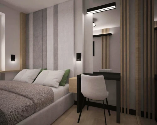 Wielozadaniowa sypialnia – sen i praca w jednej przestrzeni Sypialnia z biurkiem przy lustrze, tapicerowanym łóżkiem i zasłonami blackout