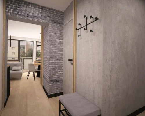 Nowoczesny przedpokój – minimalizm i funkcjonalność Przedpokój z betonową ścianą, wieszakiem i siedziskiem – aranżacja wnętrza