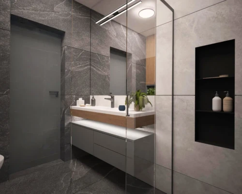 Łazienka w ciemnych barwach – stylowa i funkcjonalna przestrzeń Nowoczesna łazienka z ciemnymi płytkami i białą szafką pod umywalką – projekt łazienki Warszawa